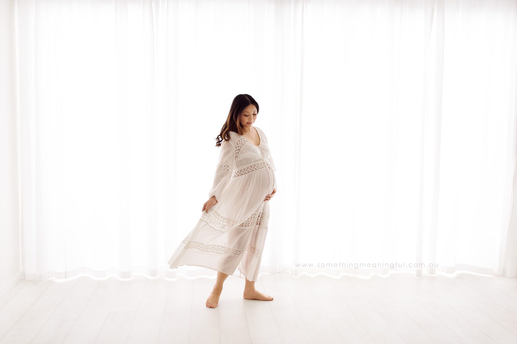"Explore our exquisite maternity gown collection, designed for comfort and style during your maternity photography session. Choose the perfect attire to enhance the beauty of your pregnancy.