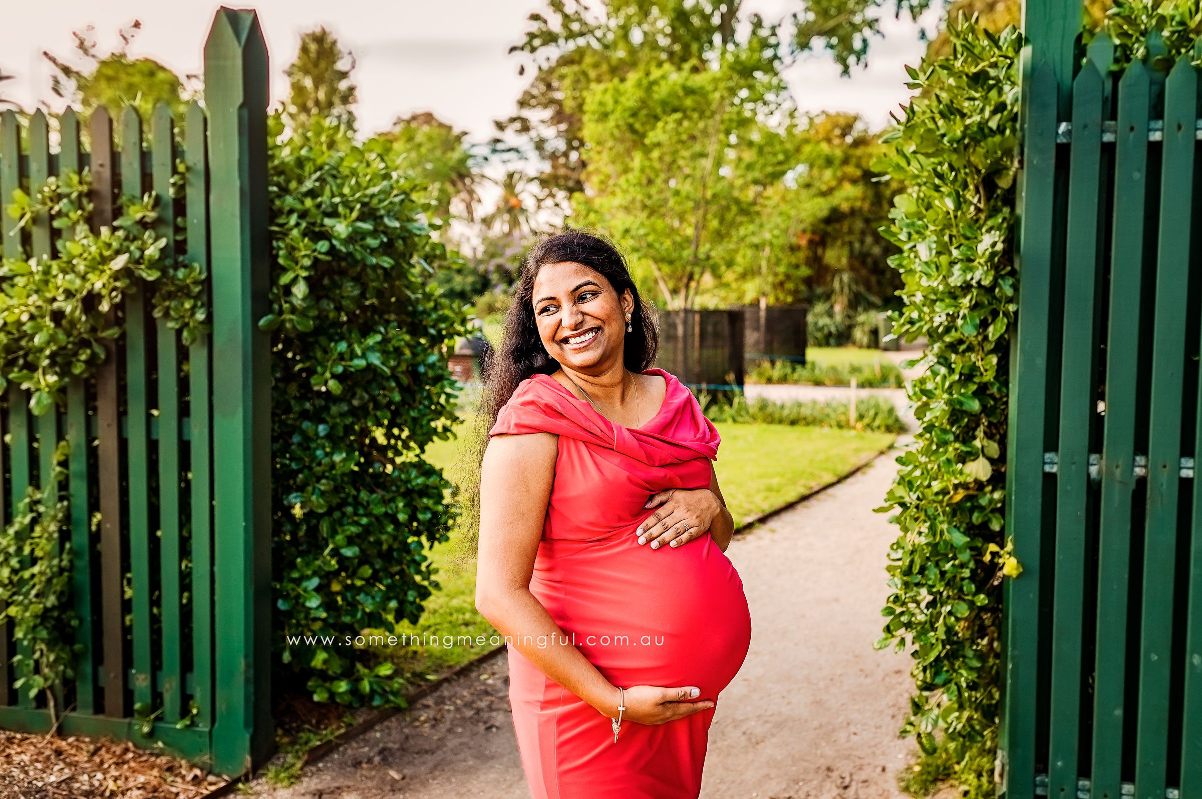 Radiant expectant mother smiling during a maternity photoshoot with Something Meaningful for Maternity Photography Melbourne West