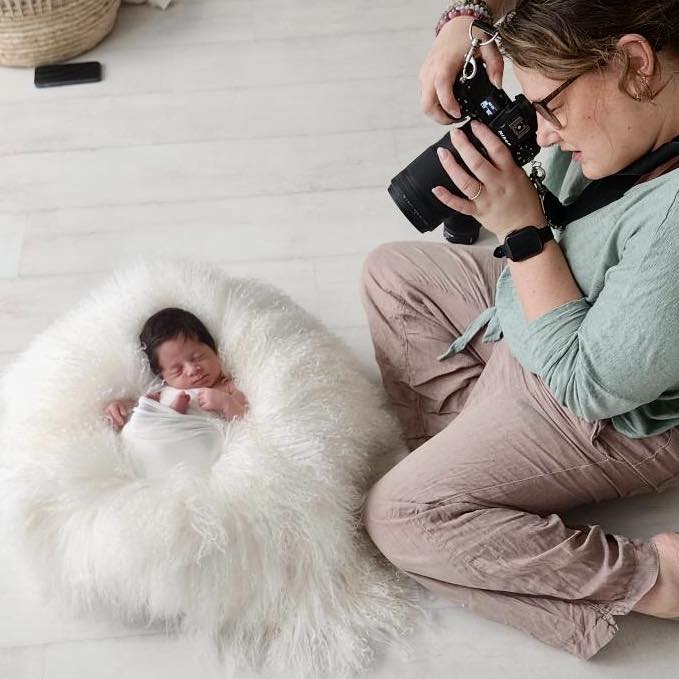 professional photographer photographing newborn baby in studio in melbourne